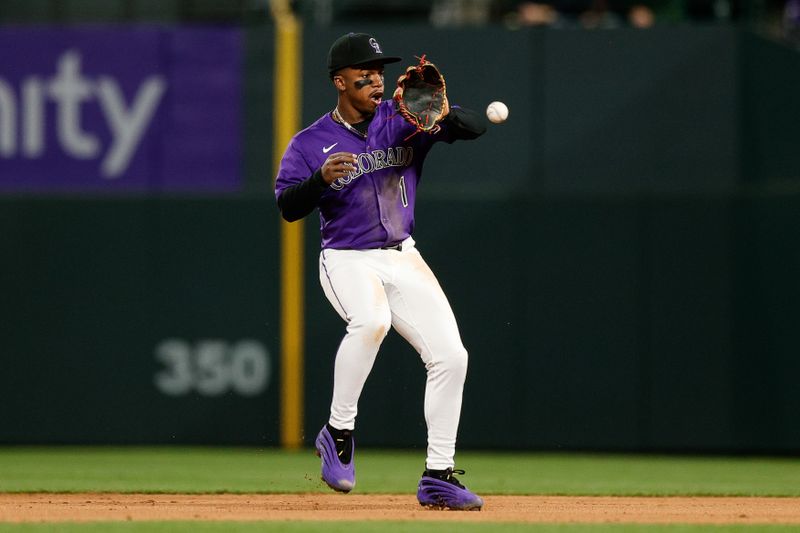 Apr 28, 2025; Denver, Colorado, USA; Colorado Rockies second baseman Adael Amador (1) fields the ball in the fifth inning against the Atlanta Braves at Coors Field. Mandatory Credit: Isaiah J. Downing-Imagn Images