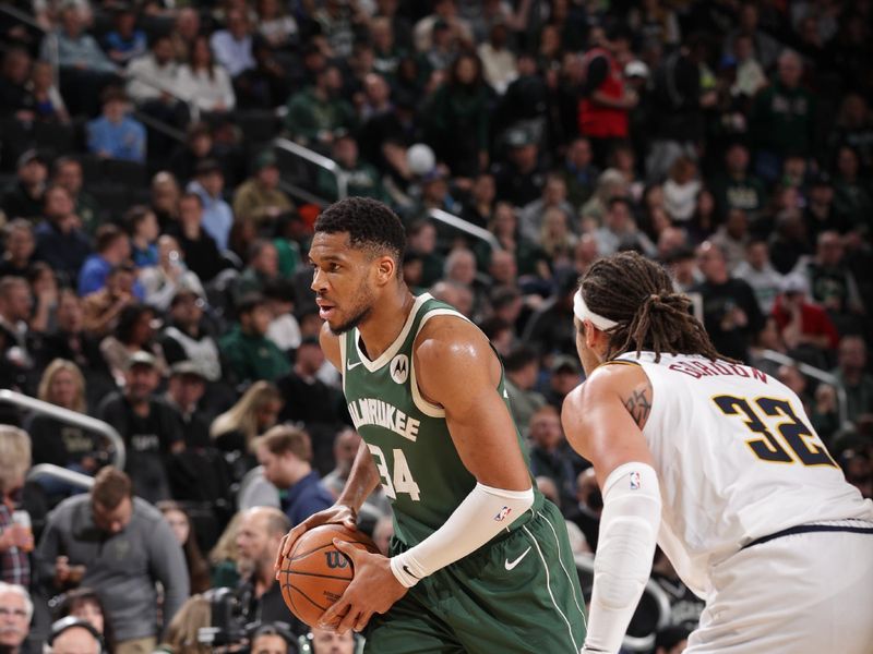 MILWAUKEE, WI - FEBRUARY 27: Giannis Antetokounmpo #34 of the Milwaukee Bucks handles the ball during the game against the Denver Nuggets on February 27, 2025 at Fiserv Forum Center in Milwaukee, Wisconsin. NOTE TO USER: User expressly acknowledges and agrees that, by downloading and or using this Photograph, user is consenting to the terms and conditions of the Getty Images License Agreement. Mandatory Copyright Notice: Copyright 2025 NBAE (Photo by Gary Dineen/NBAE via Getty Images).