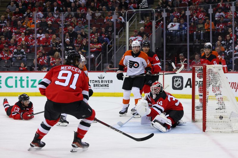 Jan 18, 2025; Newark, New Jersey, USA; Philadelphia Flyers right wing Bobby Brink (10) scores a goal on New Jersey Devils goaltender Jake Allen (34) during the third period at Prudential Center. Mandatory Credit: Ed Mulholland-Imagn Images