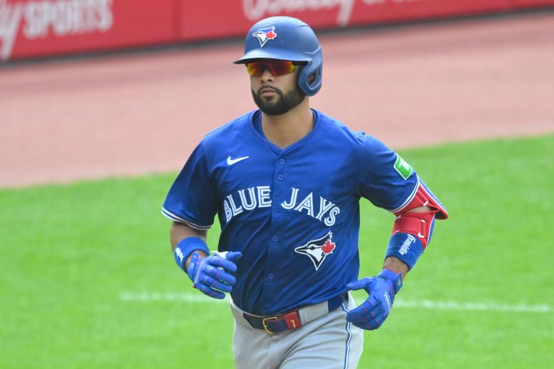 Jun 22, 2024; Cleveland, Ohio, USA; Toronto Blue Jays shortstop Isiah Kiner-Falefa (7) rounds the bases on his solo home run in the third inning against the Cleveland Guardians at Progressive Field. Mandatory Credit: David Richard-USA TODAY Sports