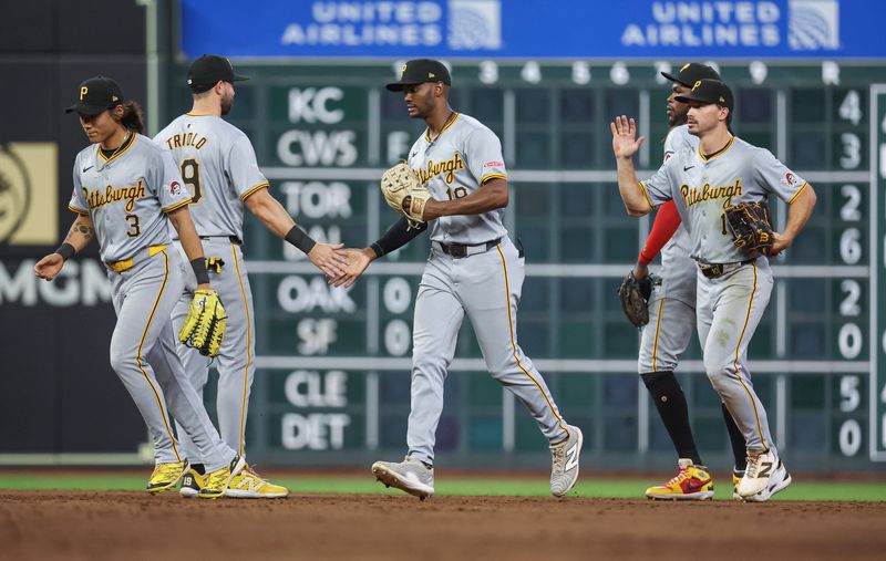 Jul 30, 2024; Houston, Texas, USA; Pittsburgh Pirates center fielder Michael A. Taylor (18) celebrates with teammates after the game against the Houston Astros at Minute Maid Park. Mandatory Credit: Troy Taormina-USA TODAY Sports