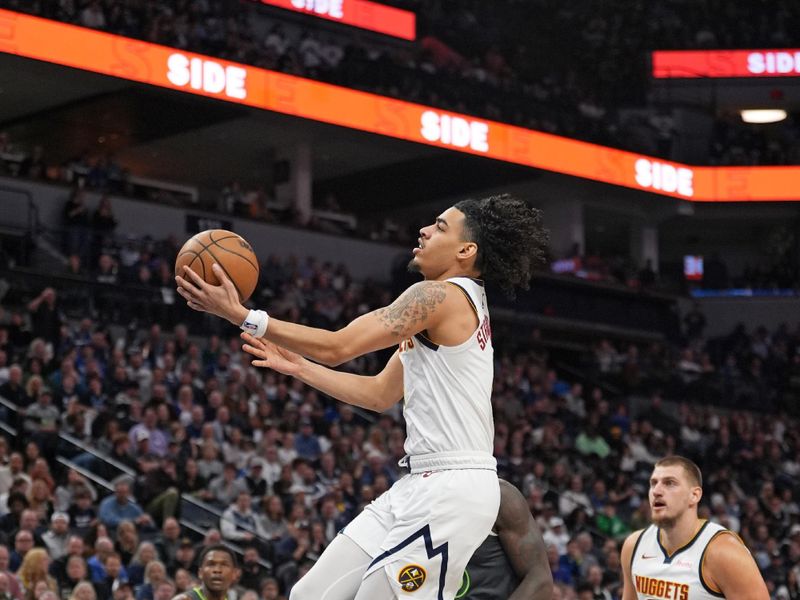 MINNEAPOLIS, MN - NOVEMBER 1: Julian Strawther #3 of the Denver Nuggets drives to the basket during the game against the Minnesota Timberwolves on November 1, 2024 at Target Center in Minneapolis, Minnesota. NOTE TO USER: User expressly acknowledges and agrees that, by downloading and or using this Photograph, user is consenting to the terms and conditions of the Getty Images License Agreement. Mandatory Copyright Notice: Copyright 2024 NBAE (Photo by Jordan Johnson/NBAE via Getty Images)