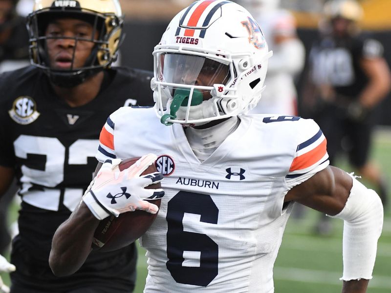 Nov 4, 2023; Nashville, Tennessee, USA; Auburn Tigers wide receiver Ja'Varrius Johnson (6) runs for a first down after a catch during the second half against the Vanderbilt Commodores at FirstBank Stadium. Mandatory Credit: Christopher Hanewinckel-USA TODAY Sports