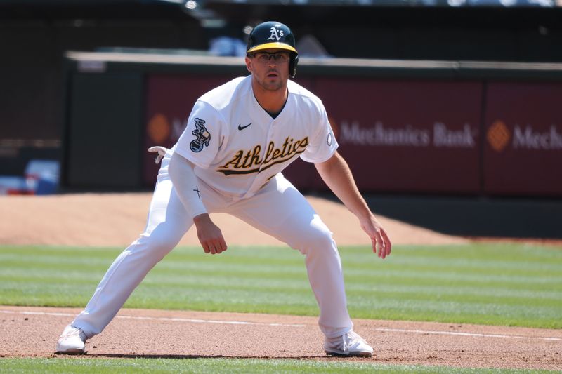 Aug 23, 2023; Oakland, California, USA; Oakland Athletics designated hitter Jonah Bride (26) takes a lead off first base against the Kansas City Royals during the first inning at Oakland-Alameda County Coliseum. Mandatory Credit: Kelley L Cox-USA TODAY Sports