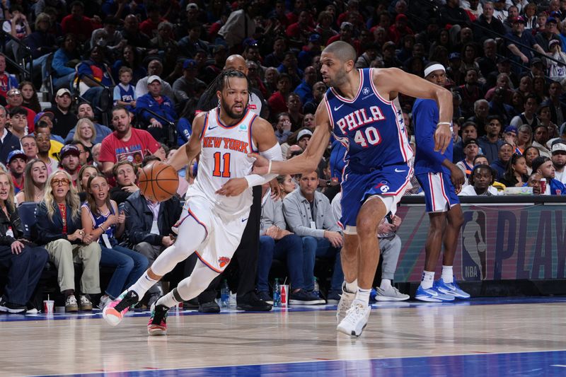 PHILADELPHIA, PA - APRIL 25: Jalen Brunson #11 of the New York Knicks dribbles the ball during the game against the Philadelphia 76ers during Round 1 Game 3 of the 2024 NBA Playoffs on April 25, 2024 at the Wells Fargo Center in Philadelphia, Pennsylvania NOTE TO USER: User expressly acknowledges and agrees that, by downloading and/or using this Photograph, user is consenting to the terms and conditions of the Getty Images License Agreement. Mandatory Copyright Notice: Copyright 2024 NBAE (Photo by Jesse D. Garrabrant/NBAE via Getty Images)