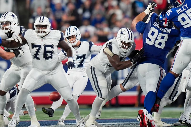 Dallas Cowboys place kicker Brandon Aubrey (17) kicks a 60-yard field goal against the New York Giants during the third quarter of an NFL football game, Thursday, Sept. 26, 2024, in East Rutherford, N.J. (AP Photo/Bryan Woolston)