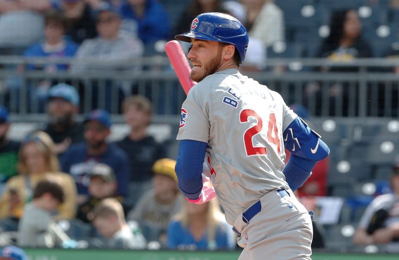 May 12, 2024; Pittsburgh, Pennsylvania, USA;  Chicago Cubs center fielder Cody Bellinger (24) hits an RBI single against the Pittsburgh Pirates during the tenth inning at PNC Park. The Cubs won 5-4 in ten innings. Mandatory Credit: Charles LeClaire-USA TODAY Sports