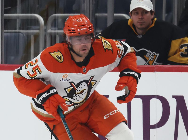 Dec 9, 2025; Pittsburgh, Pennsylvania, USA;  Anaheim Ducks center Ryan Poehling (25) moves the puck against the Pittsburgh Penguins during the second period at PPG Paints Arena. Mandatory Credit: Charles LeClaire-Imagn Images