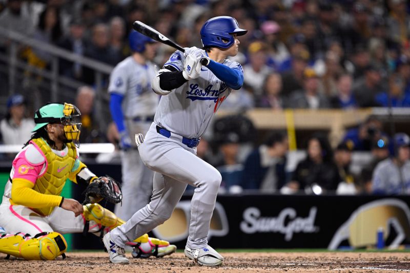 May 10, 2024; San Diego, California, USA; Los Angeles Dodgers designated hitter Shohei Ohtani (17) hits a double against the San Diego Padres during the eighth inning at Petco Park. Mandatory Credit: Orlando Ramirez-USA TODAY Sports