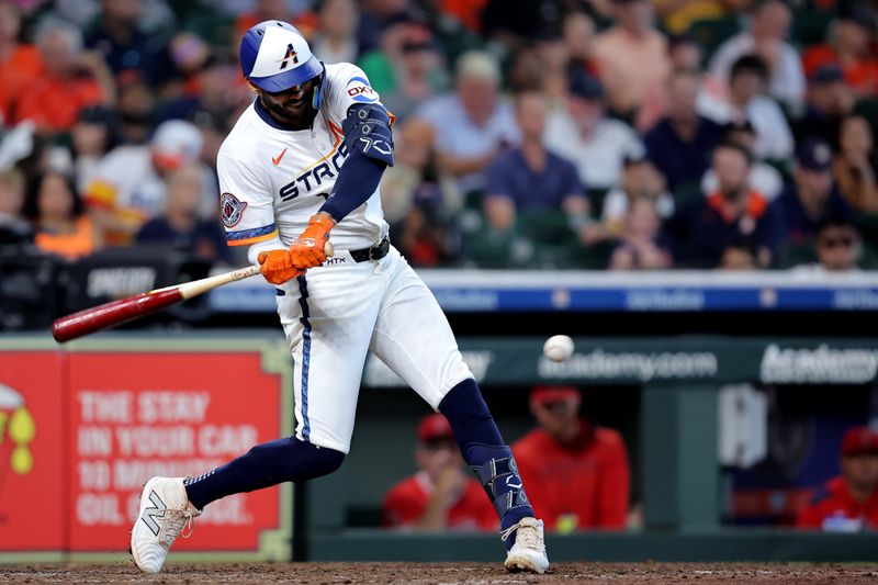 Sep 1, 2025; Houston, Texas, USA; Houston Astros third baseman Carlos Correa (1) hits an RBI single against the Los Angeles Angels during the fifth inning at Daikin Park. Mandatory Credit: Erik Williams-Imagn Images