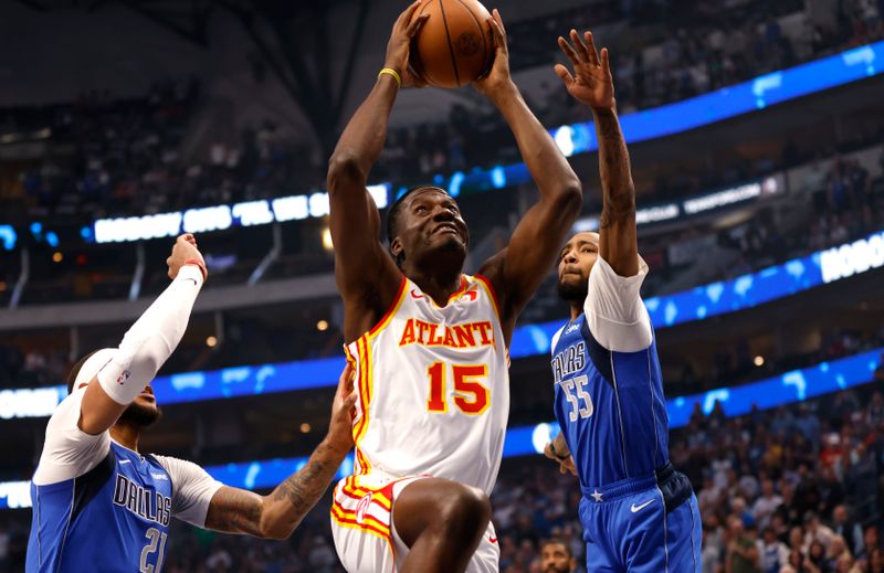 DALLAS, TX - APRIL 04: Clint Capela #15 of the Atlanta Hawks goes up for a shot against the Dallas Mavericks  in the first half at American Airlines Center on April 4, 2024 in Dallas, Texas. NOTE TO USER: User expressly acknowledges and agrees that, by downloading and or using this photograph, User is consenting to the terms and conditions of the Getty Images License Agreement. (Photo by Ron Jenkins/Getty Images)