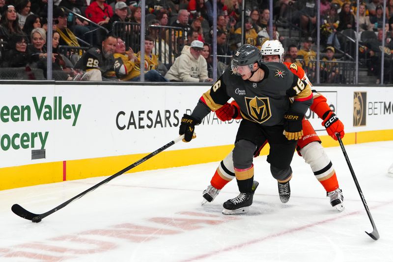 Oct 13, 2024; Las Vegas, Nevada, USA; Vegas Golden Knights left wing Pavel Dorofeyev (16) controls the puck ahead of Anaheim Ducks defenseman Radko Gudas (7) during the first period at T-Mobile Arena. Mandatory Credit: Stephen R. Sylvanie-Imagn Images