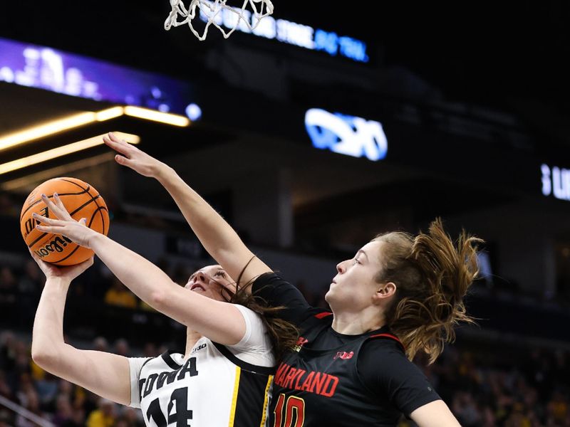 Mar 4, 2023; Minneapolis, MINN, USA; Iowa Hawkeyes forward McKenna Warnock (14) shoots while Maryland Terrapins guard Abby Meyers (10) defends during the first half at Target Center. Mandatory Credit: Matt Krohn-USA TODAY Sports