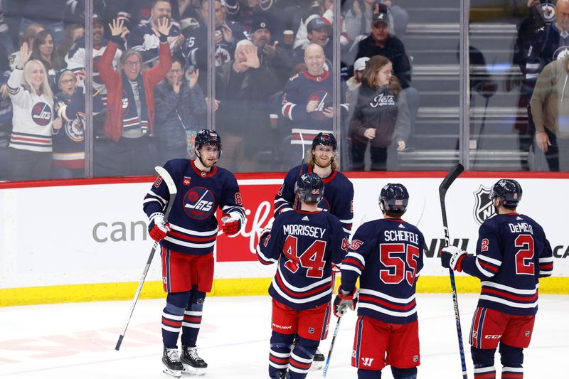 Apr 2, 2023; Winnipeg, Manitoba, CAN; Winnipeg Jets left wing Pierre-Luc Dubois (80) celebrates his third period goal against the New Jersey Devils at Canada Life Centre. Mandatory Credit: James Carey Lauder-USA TODAY Sports