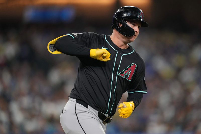 May 21, 2024; Los Angeles, California, USA; Arizona Diamondbacks designated hitter Joc Pederson (3) celebrates after hitting a three-run home run in the seventh inning against the Los Angeles Dodgers at Dodger Stadium. Mandatory Credit: Kirby Lee-USA TODAY Sports