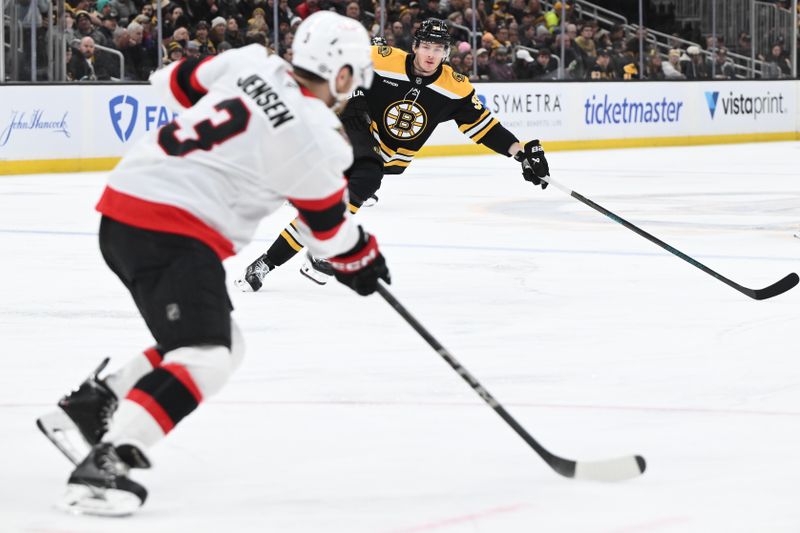 Jan 23, 2025; Boston, Massachusetts, USA; Boston Bruins center Morgan Geekie (39) skates against Ottawa Senators defenseman Nick Jensen (3) during the first period at the TD Garden. Mandatory Credit: Brian Fluharty-Imagn Images