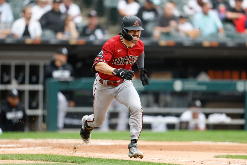 Sep 27, 2023; Chicago, Illinois, USA; Arizona Diamondbacks left fielder Corbin Carroll (7) runs to second base after hitting a two-run double against the Chicago White Sox during the third inning at Guaranteed Rate Field. Mandatory Credit: Kamil Krzaczynski-USA TODAY Sports