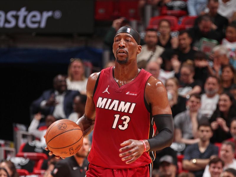 MIAMI, FL - MARCH 10: Bam Adebayo #13 of the Miami Heat brings the ball up court during the game against the Washington Wizards on March 10, 2024 at Kaseya Center in Miami, Florida. NOTE TO USER: User expressly acknowledges and agrees that, by downloading and or using this Photograph, user is consenting to the terms and conditions of the Getty Images License Agreement. Mandatory Copyright Notice: Copyright 2024 NBAE (Photo by Issac Baldizon/NBAE via Getty Images)