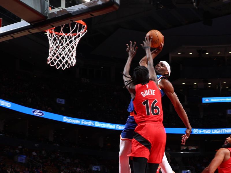 TORONTO, CANADA - MARCH 27: Precious Achiuwa #5 of the New York Knicks dunks the ball during the game against the Toronto Raptors on March 27, 2024 at the Scotiabank Arena in Toronto, Ontario, Canada.  NOTE TO USER: User expressly acknowledges and agrees that, by downloading and or using this Photograph, user is consenting to the terms and conditions of the Getty Images License Agreement.  Mandatory Copyright Notice: Copyright 2024 NBAE (Photo by Vaughn Ridley/NBAE via Getty Images)