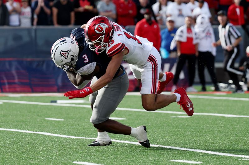 Nov 18, 2023; Tucson, Arizona, USA; Utah Utes cornerback Tao Johnson (15) tackles Arizona Wildcats running back Jonah Coleman (3) during the second half at Arizona Stadium. Mandatory Credit: Zachary BonDurant-USA TODAY Sports