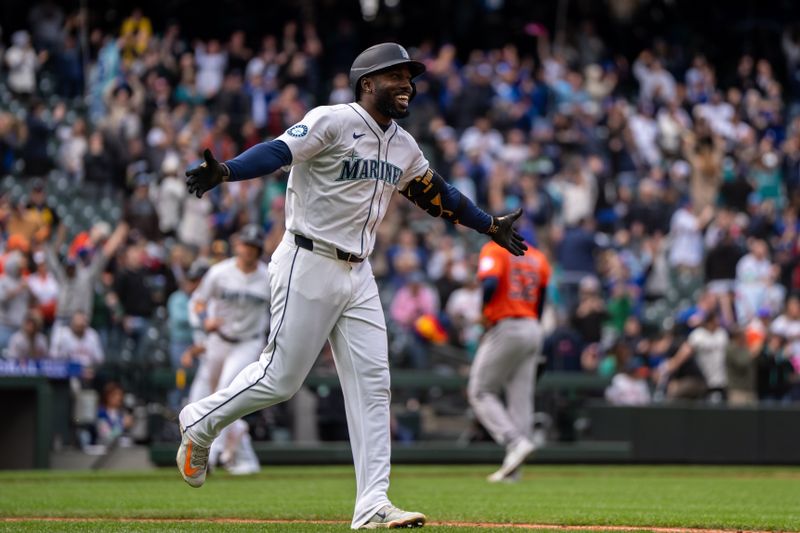 Apr 9, 2025; Seattle, Washington, USA;  Seattle Mariners left fielder Randy Arozarena (56) celebrates a walk-off walk against the Houston Astros at T-Mobile Park. Mandatory Credit: Stephen Brashear-Imagn Images