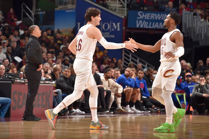 CLEVELAND, OH - JANUARY 29: Cedi Osman #16 of the Cleveland Cavaliers high fives Donovan Mitchell #45 during the game against the LA Clippers on January 29, 2023 at Rocket Mortgage FieldHouse in Cleveland, Ohio. NOTE TO USER: User expressly acknowledges and agrees that, by downloading and/or using this Photograph, user is consenting to the terms and conditions of the Getty Images License Agreement. Mandatory Copyright Notice: Copyright 2023 NBAE (Photo by David Liam Kyle/NBAE via Getty Images)