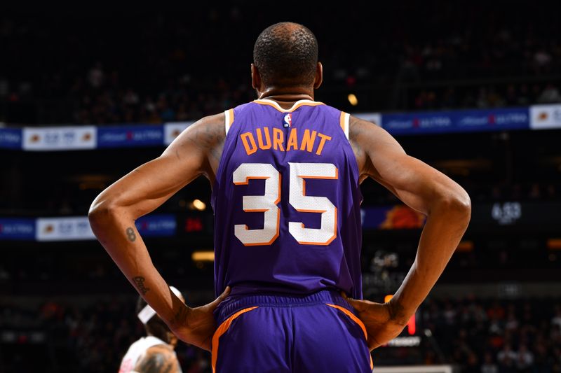 PHOENIX, AZ - MARCH 7: Kevin Durant #35 of the Phoenix Suns looks on during the game against the Toronto Raptors on March 7, 2024 at Footprint Center in Phoenix, Arizona. NOTE TO USER: User expressly acknowledges and agrees that, by downloading and or using this photograph, user is consenting to the terms and conditions of the Getty Images License Agreement. Mandatory Copyright Notice: Copyright 2024 NBAE (Photo by Barry Gossage/NBAE via Getty Images)