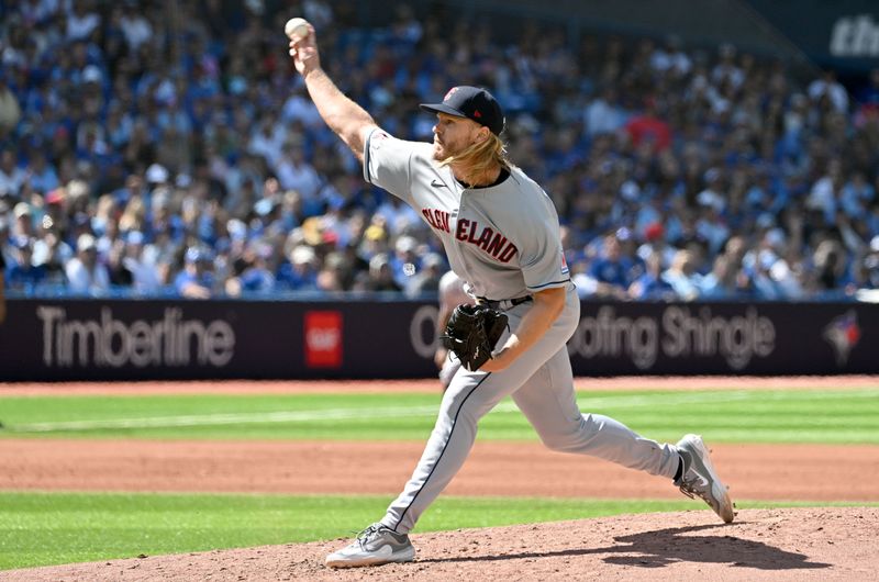 Aug 27, 2023; Toronto, Ontario, CAN;  Cleveland Guardians starting pitcher Noah Syndergaard (34) delivers a pitch against the Toronto Blue Jays in the fourth inning at Rogers Centre. Mandatory Credit: Dan Hamilton-USA TODAY Sports