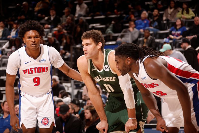 DETROIT, MI - JANUARY 22:  Ausar Thompson #9 and Isaiah Stewart #28 of the Detroit Pistons plays defense against Brook Lopez #11 of the Milwaukee Bucks on January 22, 2024 at Little Caesars Arena in Detroit, Michigan. NOTE TO USER: User expressly acknowledges and agrees that, by downloading and/or using this photograph, User is consenting to the terms and conditions of the Getty Images License Agreement. Mandatory Copyright Notice: Copyright 2024 NBAE (Photo by Brian Sevald/NBAE via Getty Images)