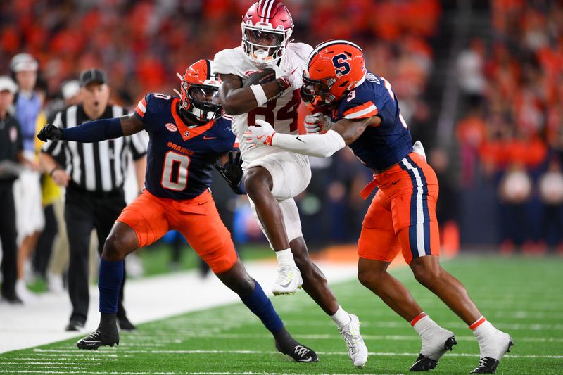 Sep 20, 2024; Syracuse, New York, USA; Stanford Cardinal wide receiver Ismael Cisse (84) runs between Syracuse Orange defensive backs Duce Chestnut (0) and Clarence Lewis (3) during the first half at the JMA Wireless Dome. Mandatory Credit: Rich Barnes-Imagn Images