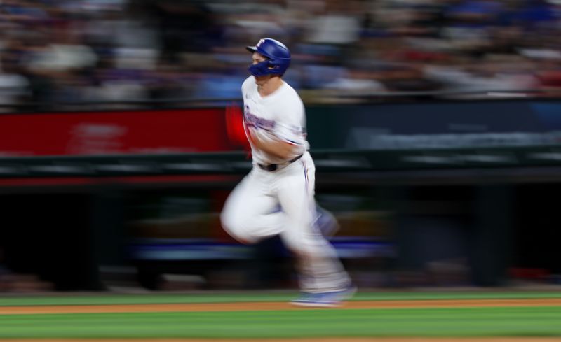 Jul 2, 2024; Arlington, Texas, USA;  Texas Rangers left fielder Wyatt Langford (36) runs after hitting a double during the fifth inning against the San Diego Padres at Globe Life Field. Mandatory Credit: Kevin Jairaj-USA TODAY Sports