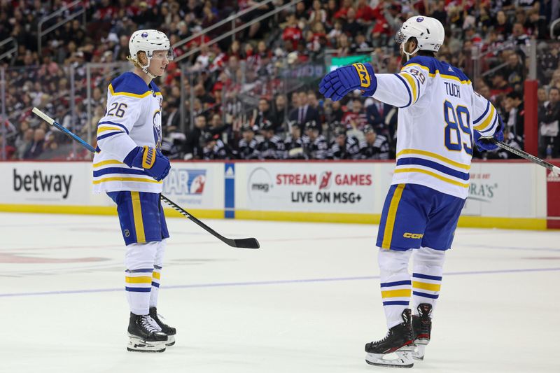 Oct 27, 2023; Newark, New Jersey, USA; Buffalo Sabres defenseman Rasmus Dahlin (26) celebrates his goal with right wing Alex Tuch (89) during the second period against the New Jersey Devils at Prudential Center. Mandatory Credit: Vincent Carchietta-USA TODAY Sports