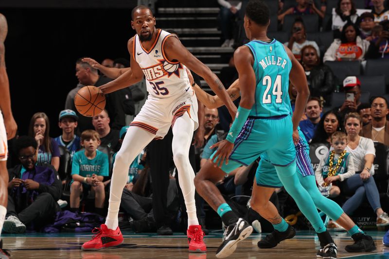 CHARLOTTE, NC - MARCH 15: Kevin Durant #35 of the Phoenix Suns handles the ball during the game against the Charlotte Hornets on March 15, 2024 at Spectrum Center in Charlotte, North Carolina. NOTE TO USER: User expressly acknowledges and agrees that, by downloading and or using this photograph, User is consenting to the terms and conditions of the Getty Images License Agreement. Mandatory Copyright Notice: Copyright 2024 NBAE (Photo by Kent Smith/NBAE via Getty Images)