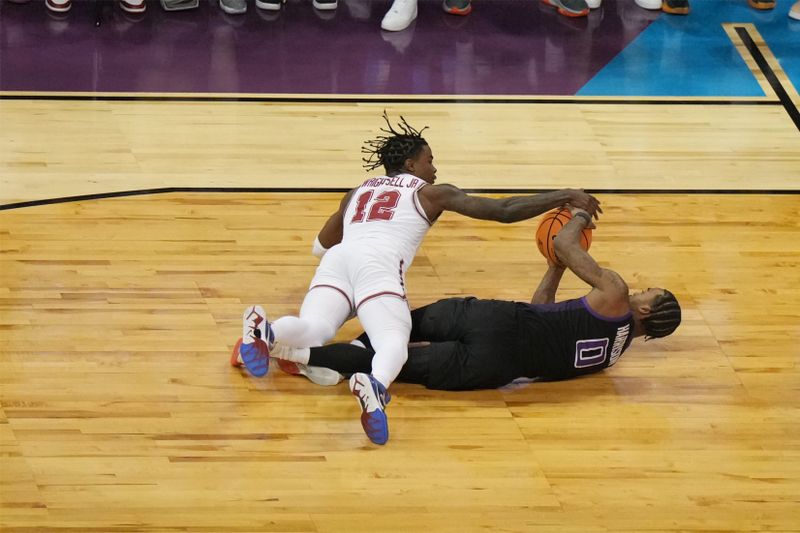 Mar 24, 2024; Spokane, WA, USA; Alabama Crimson Tide guard Latrell Wrightsell Jr. (12) battles Grand Canyon Antelopes guard Jovan Blacksher Jr. (10) for the ball in the first half at Spokane Veterans Memorial Arena. Mandatory Credit: Kirby Lee-USA TODAY Sports