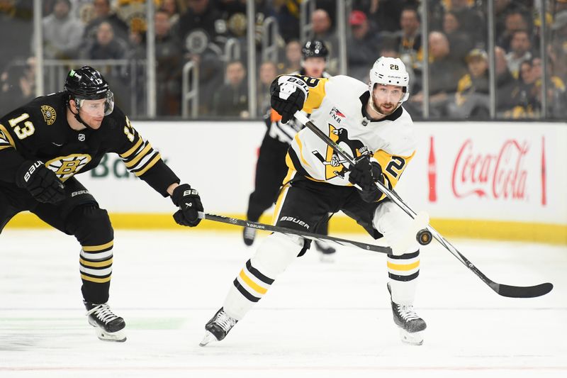 Jan 4, 2024; Boston, Massachusetts, USA; Pittsburgh Penguins defenseman Marcus Pettersson (28) pushes the puck up ice while Boston Bruins center Charlie Coyle (13) defends during the second period at TD Garden. Mandatory Credit: Bob DeChiara-USA TODAY Sports