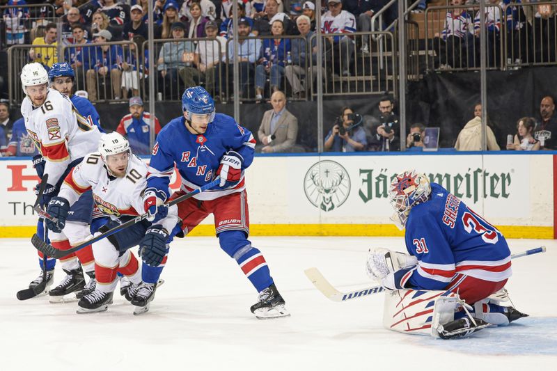 May 24, 2024; New York, New York, USA; New York Rangers goaltender Igor Shesterkin (31) makes a save in front of defenseman Braden Schneider (4) and Florida Panthers right wing Vladimir Tarasenko (10) in game two of the Eastern Conference Final of the 2024 Stanley Cup Playoffs at Madison Square Garden. Mandatory Credit: Vincent Carchietta-USA TODAY Sports