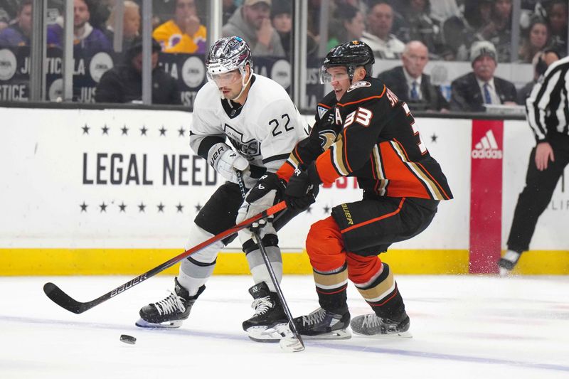 Apr 13, 2024; Los Angeles, California, USA; LA Kings left wing Kevin Fiala (22) and Anaheim Ducks right wing Jakob Silfverberg (33) babble for the puck in the second period at Crypto.com Arena. Mandatory Credit: Kirby Lee-USA TODAY Sports