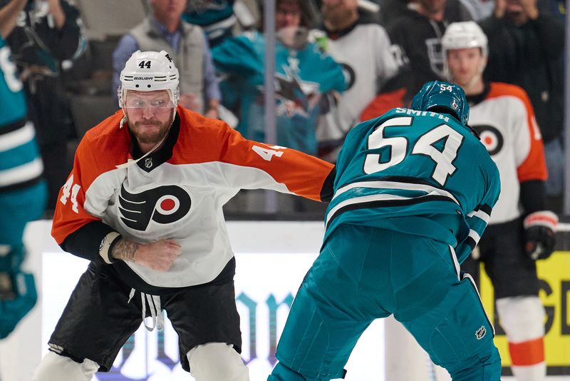 Nov 7, 2023; San Jose, California, USA; Philadelphia Flyers left wing Nicolas Deslauriers (44) fights with San Jose Sharks right wing Givani Smith (54) during the first period at SAP Center at San Jose. Mandatory Credit: Robert Edwards-USA TODAY Sports