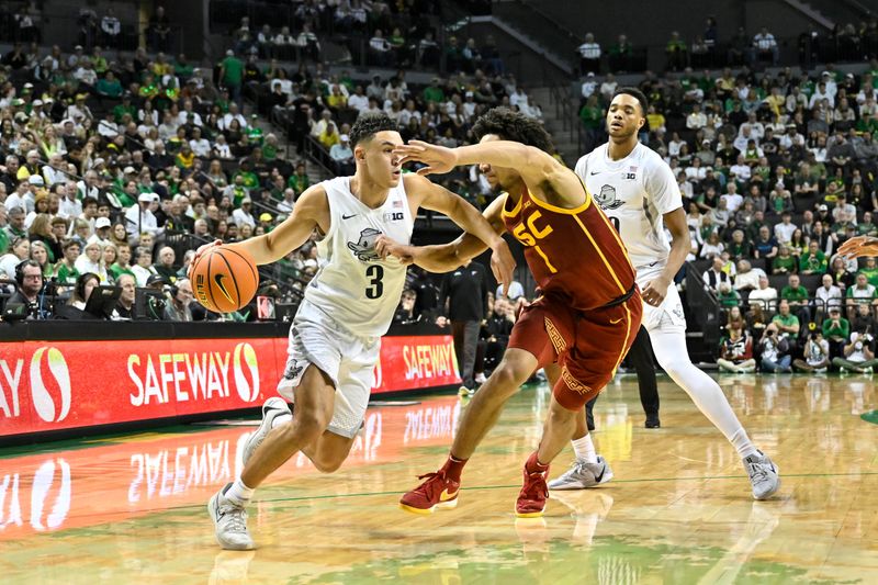 Mar 1, 2025; Eugene, Oregon, USA; Oregon Ducks guard Jackson Shelstad (3) drives to the basket against USC Trojans guard Desmond Claude (1) during the first half at Matthew Knight Arena. Mandatory Credit: Craig Strobeck-Imagn Images