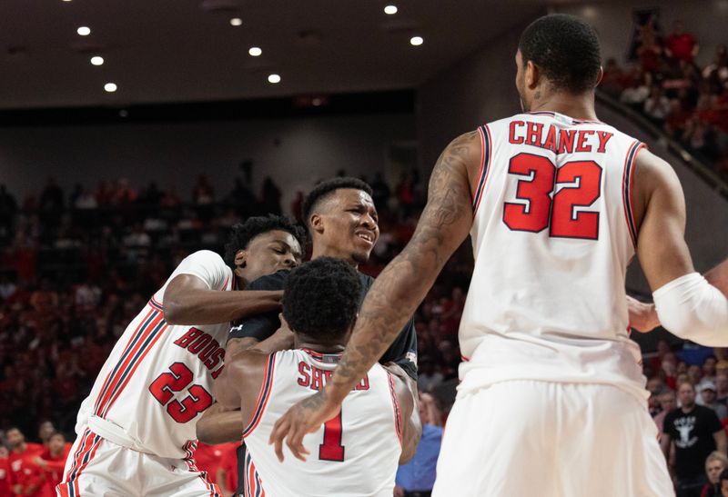 Jan 28, 2023; Houston, Texas, USA; Houston Cougars guard Terrance Arceneaux (23) and Houston Cougars guard Jamal Shead (1) tie up the ball with Cincinnati Bearcats guard Landers Nolley II (2) in the second half at Fertitta Center. Houston Cougars won 75 to 69 .Mandatory Credit: Thomas Shea-USA TODAY Sports