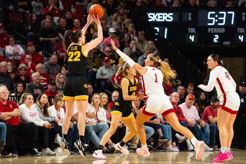 Feb 11, 2024; Lincoln, Nebraska, USA; Iowa Hawkeyes guard Caitlin Clark (22) shoots a three point shot against Nebraska Cornhuskers guard Jaz Shelley (1) during the second quarter at Pinnacle Bank Arena. Mandatory Credit: Dylan Widger-USA TODAY Sports