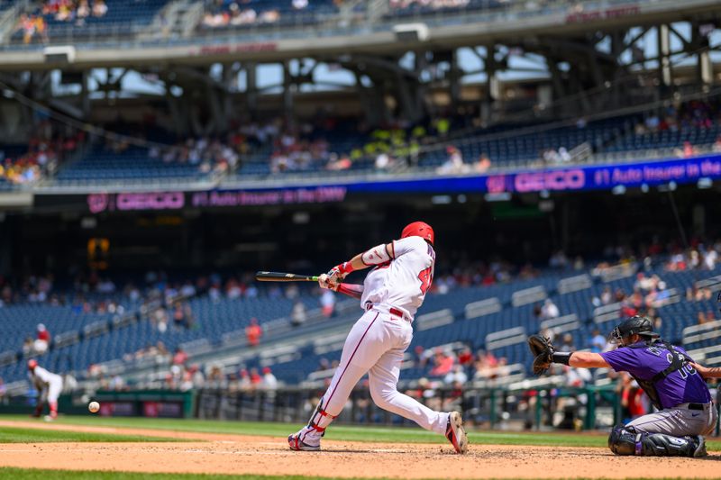 Jul 26, 2023; Washington, District of Columbia, USA; Washington Nationals designated hitter Joey Meneses (45) hits a single during the ninth inning against the Colorado Rockies at Nationals Park. Mandatory Credit: Reggie Hildred-USA TODAY Sports