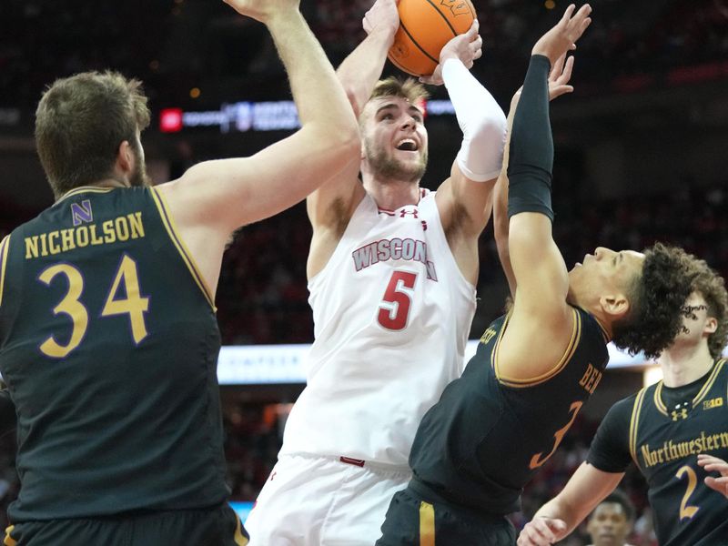 Jan 13, 2024; Madison, Wisconsin, USA; Wisconsin Badgers forward Tyler Wahl (5) shoots against Northwestern Wildcats guard Ty Berry (3) and center Matthew Nicholson (34) during the second half at the Kohl Center. Mandatory Credit: Kayla Wolf-USA TODAY Sports