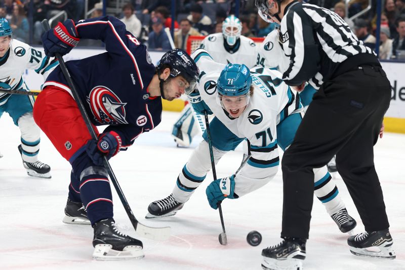 Jan 16, 2025; Columbus, Ohio, USA;  San Jose Sharks center Macklin Celebrini (71) faces off with Columbus Blue Jackets center Cole Sillinger (4) during the first period at Nationwide Arena. Mandatory Credit: Joseph Maiorana-Imagn Images