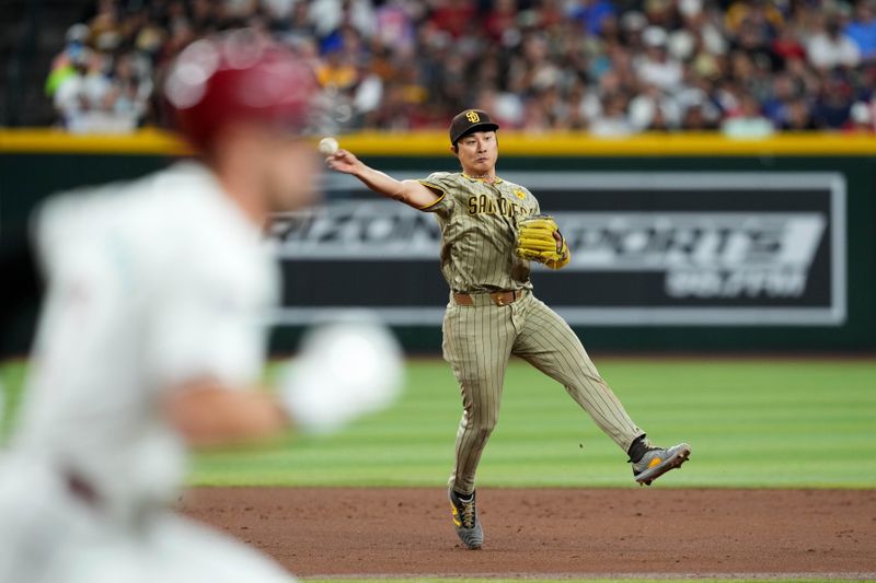 May 3, 2024; Phoenix, Arizona, USA; San Diego Padres shortstop Ha-Seong Kim (7) throws to first base to force out Arizona Diamondbacks shortstop Blaze Alexander (9) during the third inning at Chase Field. Mandatory Credit: Joe Camporeale-USA TODAY Sports