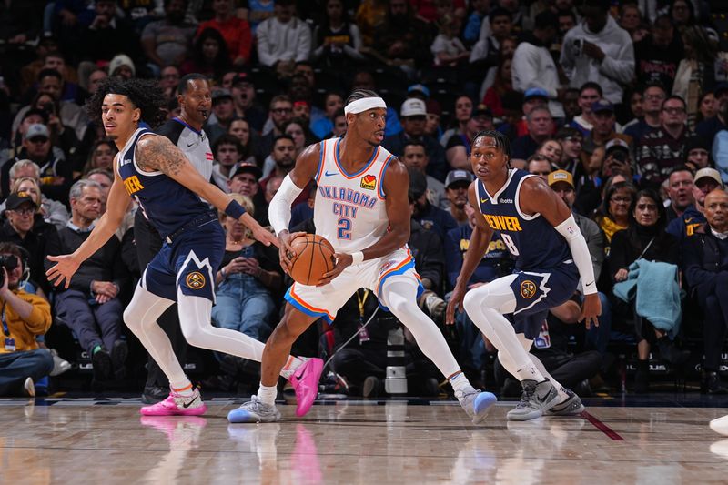 DENVER, CO - NOVEMBER 6: Shai Gilgeous-Alexander #2 of the Oklahoma City Thunder handles the ball during the game against the Denver Nuggets during a regular season game on November 6, 2024 at Ball Arena in Denver, Colorado. NOTE TO USER: User expressly acknowledges and agrees that, by downloading and/or using this Photograph, user is consenting to the terms and conditions of the Getty Images License Agreement. Mandatory Copyright Notice: Copyright 2024 NBAE (Photo by Bart Young/NBAE via Getty Images)