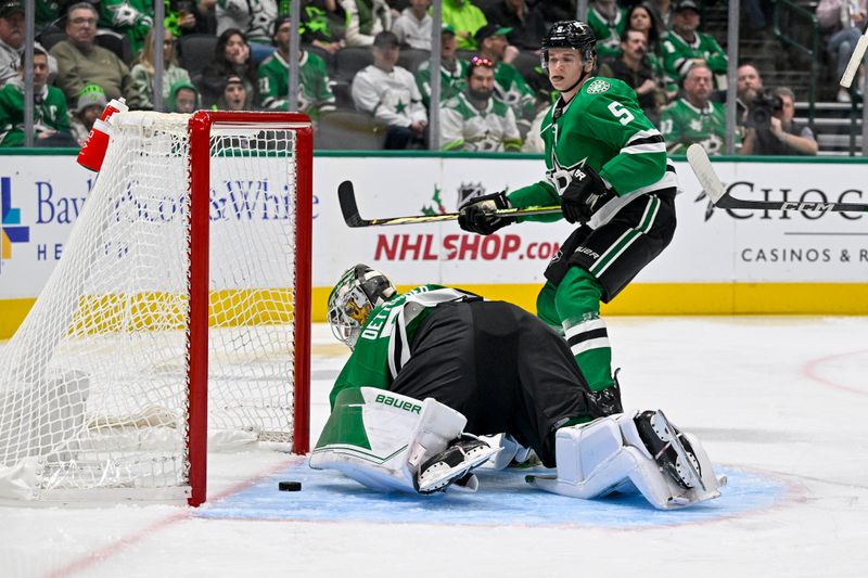 Dec 9, 2023; Dallas, Texas, USA; Dallas Stars defenseman Nils Lundkvist (5) and goaltender Jake Oettinger (29) look on as a shot by Vegas Golden Knights center Chandler Stephenson (not pictured) gets past Oettinger during the first period at the American Airlines Center. Mandatory Credit: Jerome Miron-USA TODAY Sports