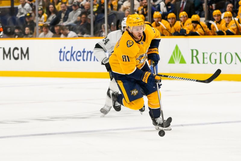 Nov 4, 2024; Nashville, Tennessee, USA;  Nashville Predators center Jonathan Marchessault (81) skates with the puck against the Los Angeles Kings during the first period at Bridgestone Arena. Mandatory Credit: Steve Roberts-Imagn Images