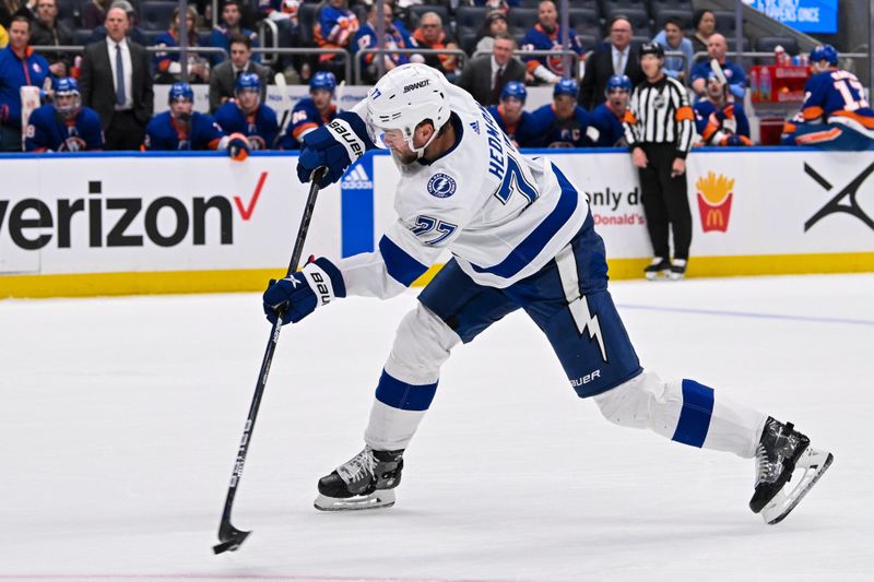 Feb 8, 2024; Elmont, New York, USA; Tampa Bay Lightning defenseman Victor Hedman (77) attempts a shot against the New York Islanders during the first period at UBS Arena. Mandatory Credit: Dennis Schneidler-USA TODAY Sports