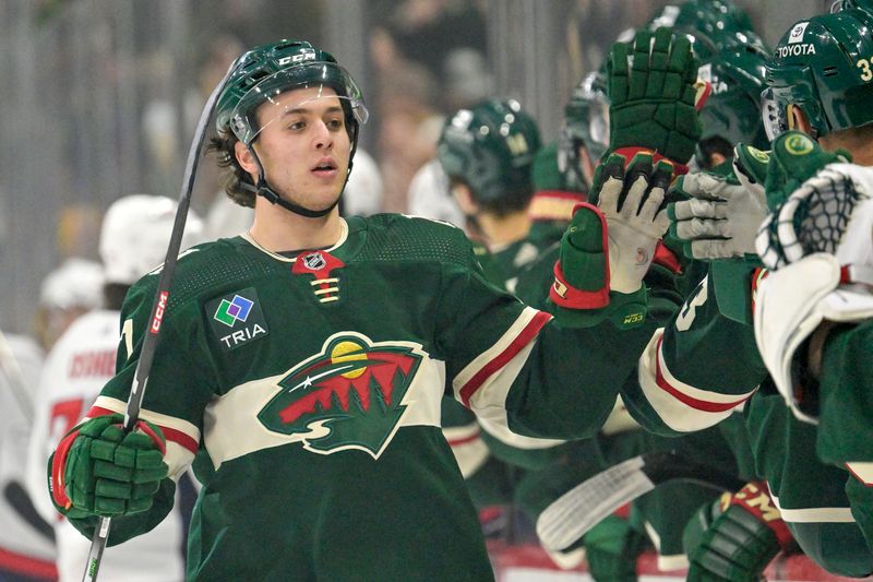 Jan 23, 2024; Saint Paul, Minnesota, USA;  Minnesota Wild defenseman Brock Faber (7) celebrates his goal against the Washington Capitals during the first period at Xcel Energy Center. Mandatory Credit: Nick Wosika-USA TODAY Sports